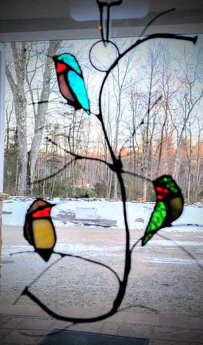 Three Purched Hummingbirds