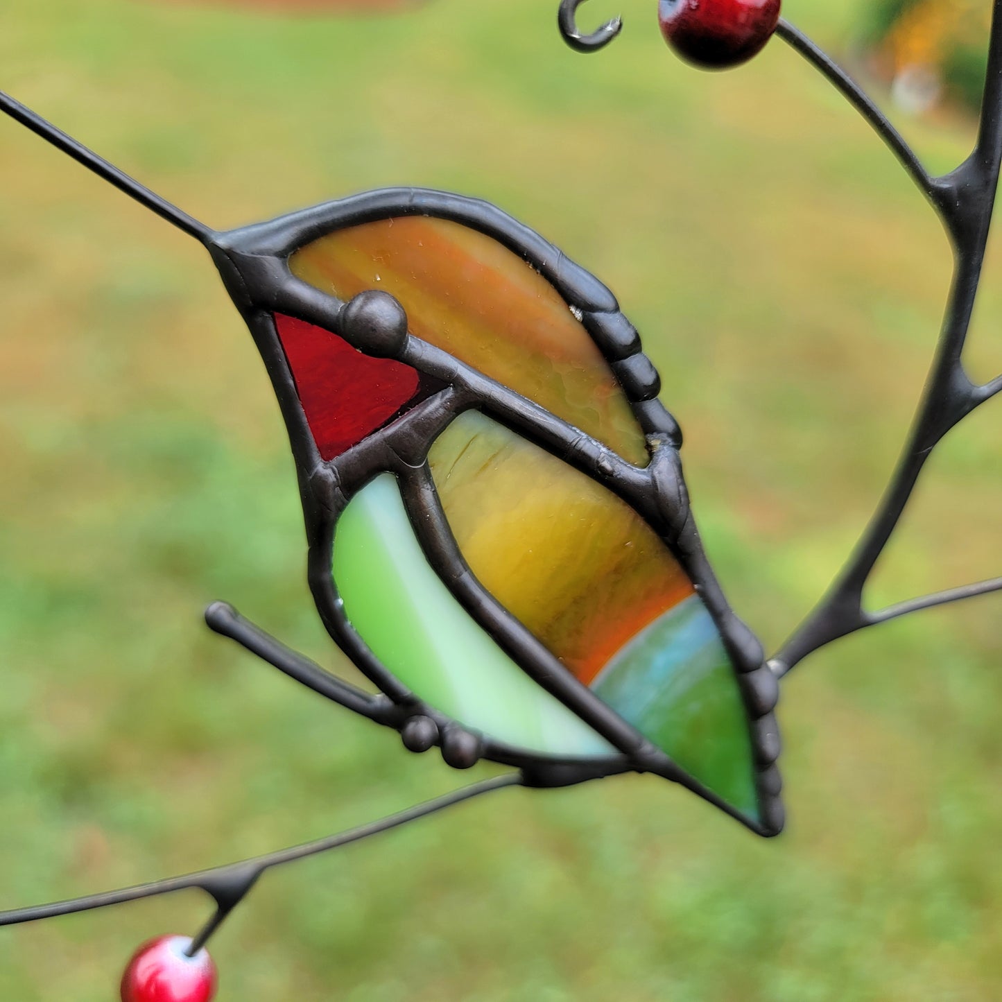 Stained-Glass Single Hummingbird Purched on Branch