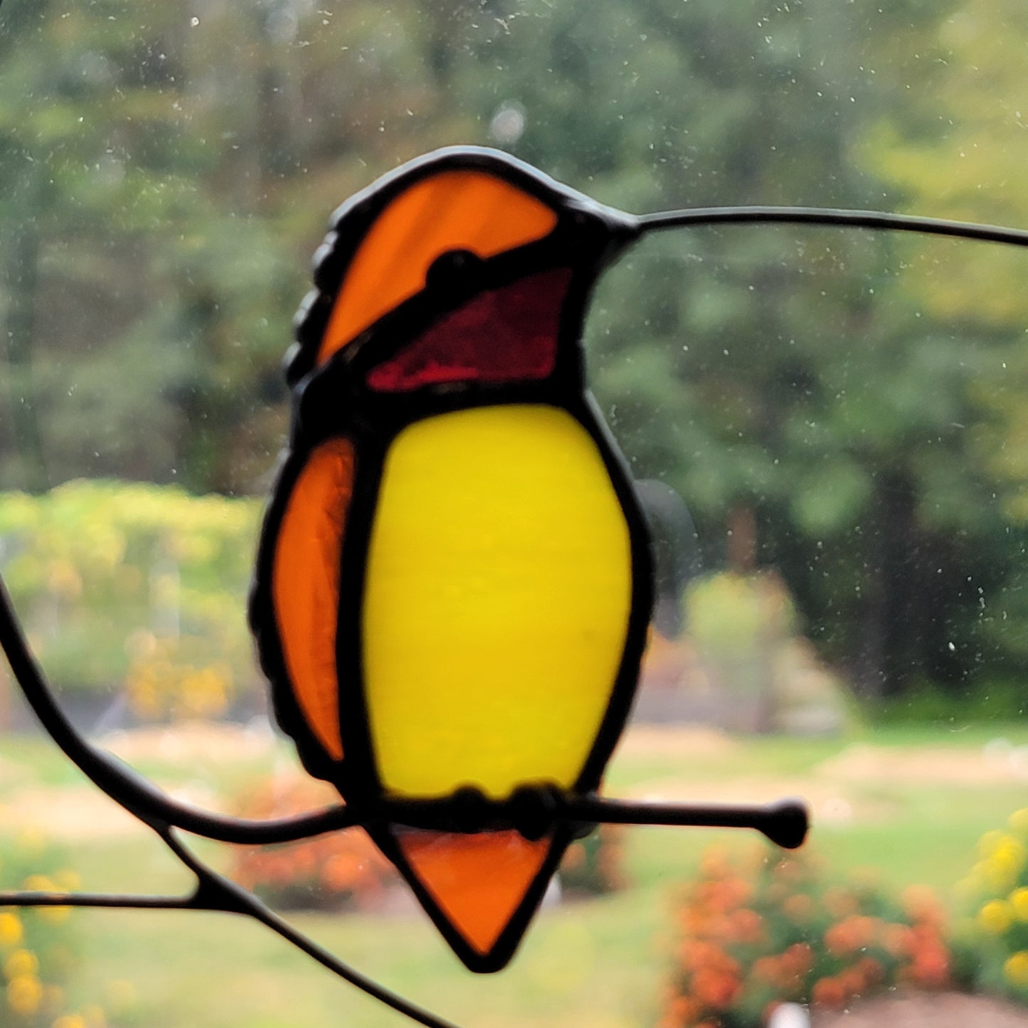 Stained-Glass Single Hummingbird Purched on Branch
