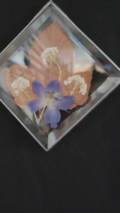 Dried Flowers Pressed Between Two Diamond Bevels
